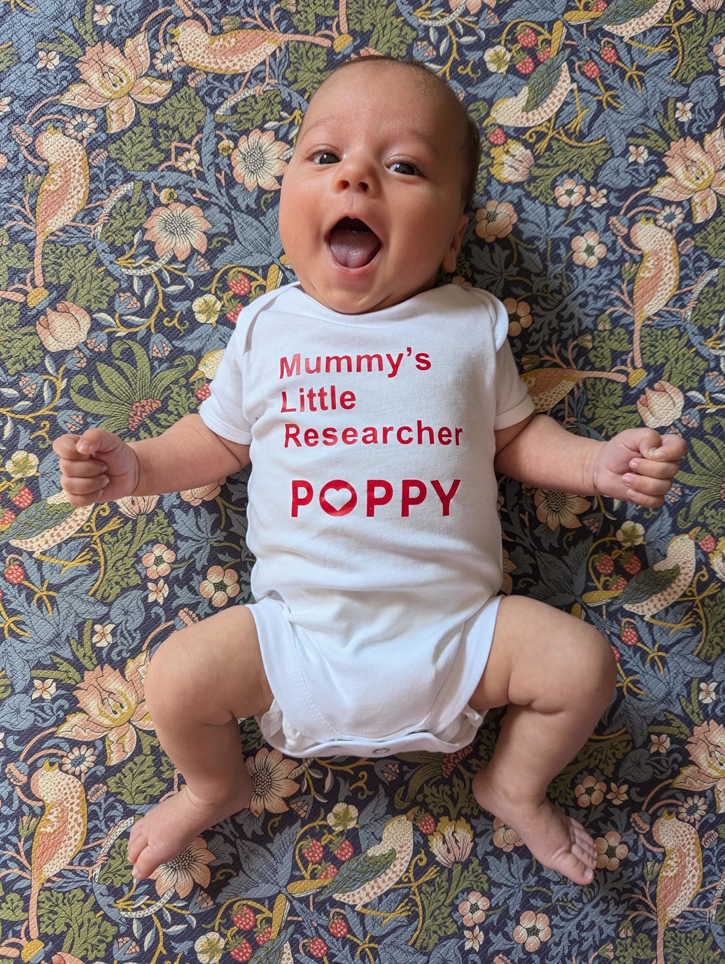 Idris wearing his POPPY bodysuit