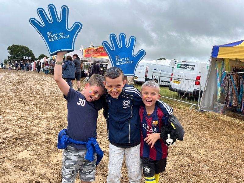 Children play with blue foam hands