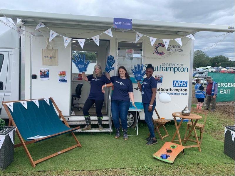 Staff pose by the research van 